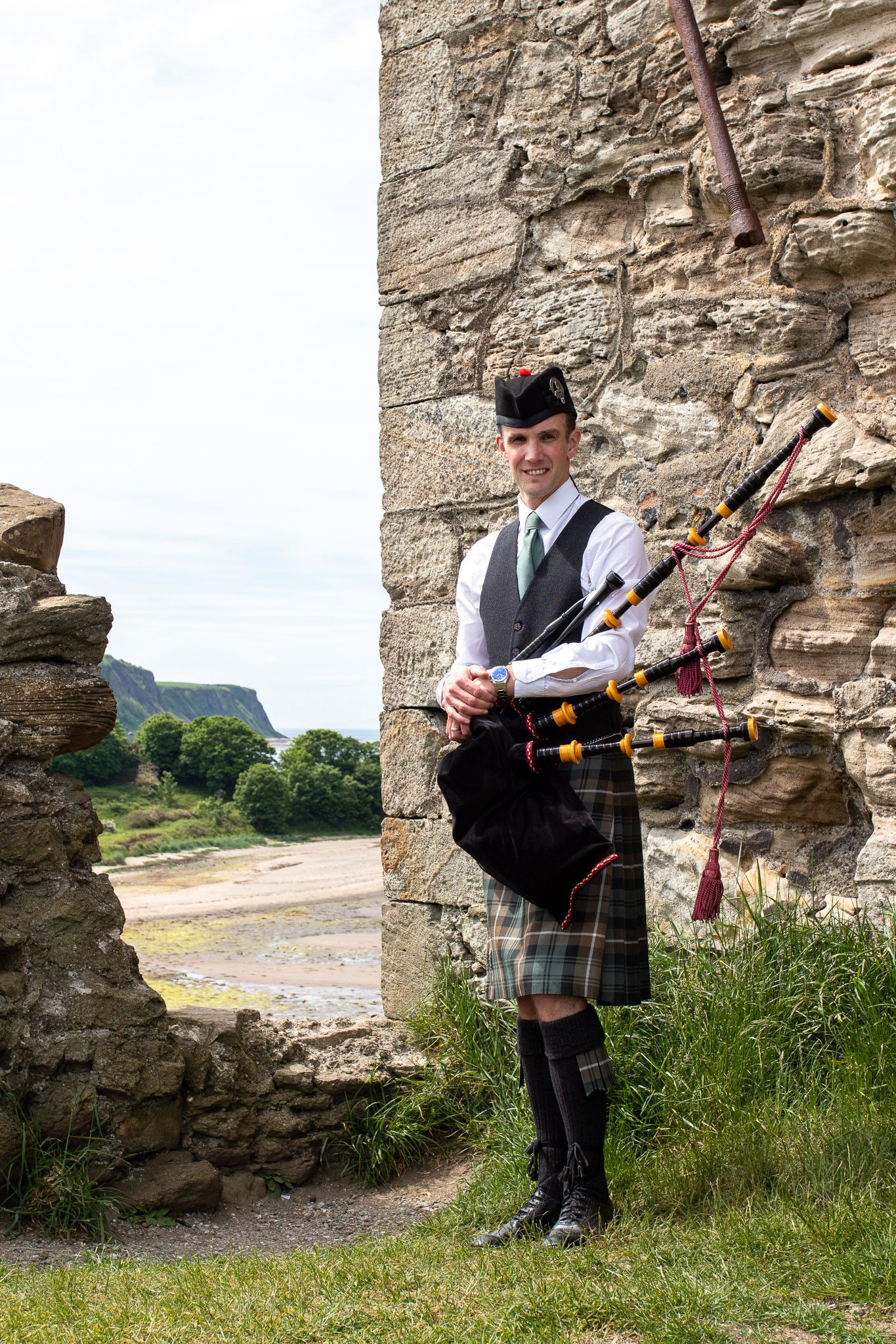 Alistair Brown Ayrshire Piper playing bagpipes and wearing lamont kilt at Greenan Shore in Ayr, Scotland (16 of 74)