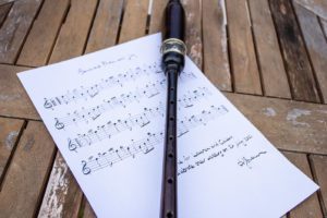 Alistair Brown's practice chanter lying on top of practice music, that has been printed as a gift for someone's wedding