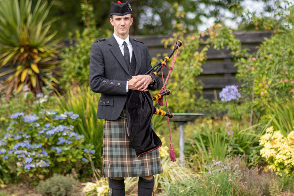 Alistair-Brown-Ayrshire-Bagpiper-for-Funerals-standing-ready-to-play